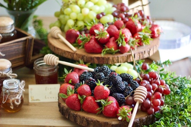 Fruit and honey display baby shower idea. Click to see even more food ideas from this Classic Winnie the Pooh baby shower! 