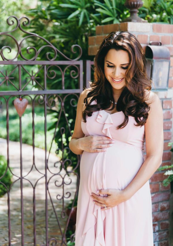 ASOS blush pink ruffle maternity dress. Click to see the rest of the photos from this tea party baby shower on the blog!
