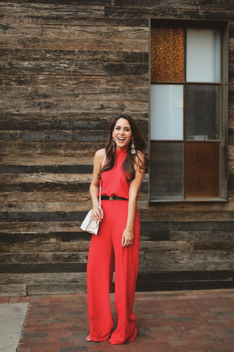 classy red halter jumpsuit with louis vuitton belt