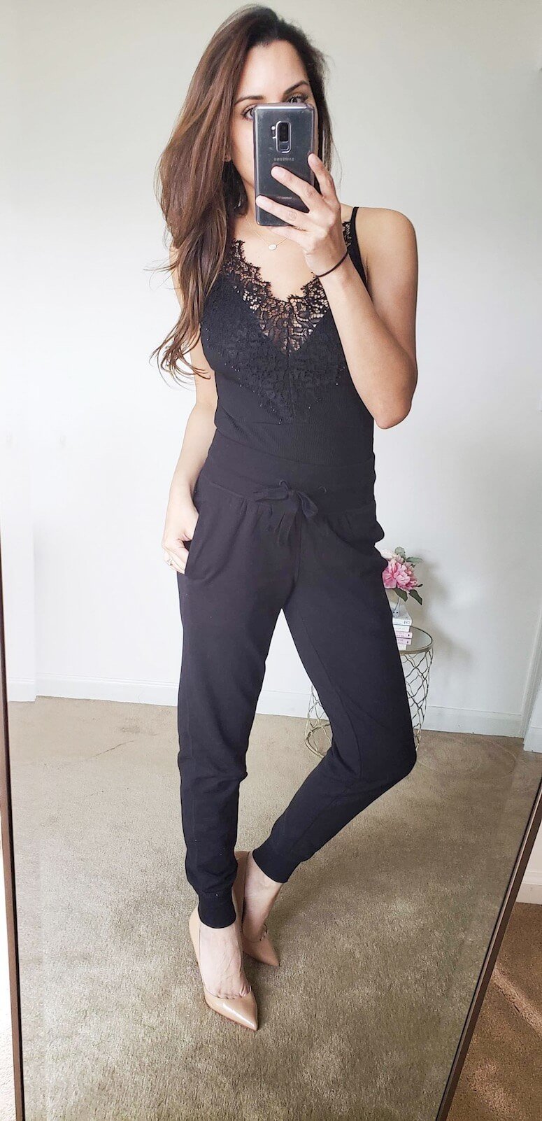 black jogger pants with a bodysuit and heels