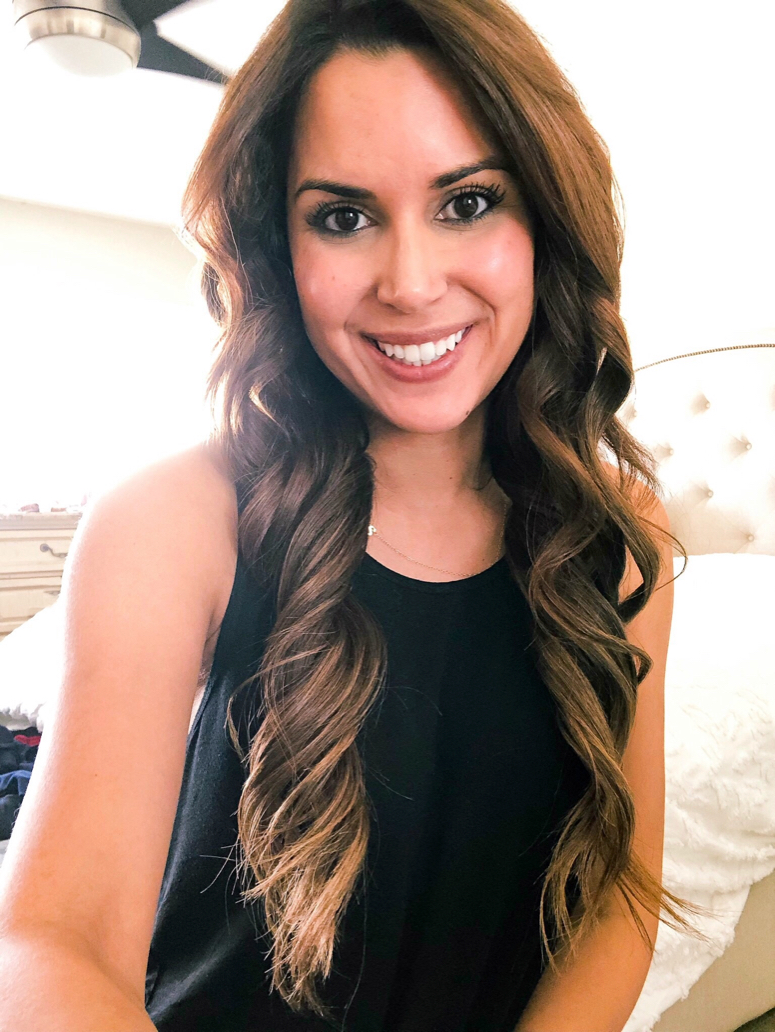 brunette woman with long hair curls