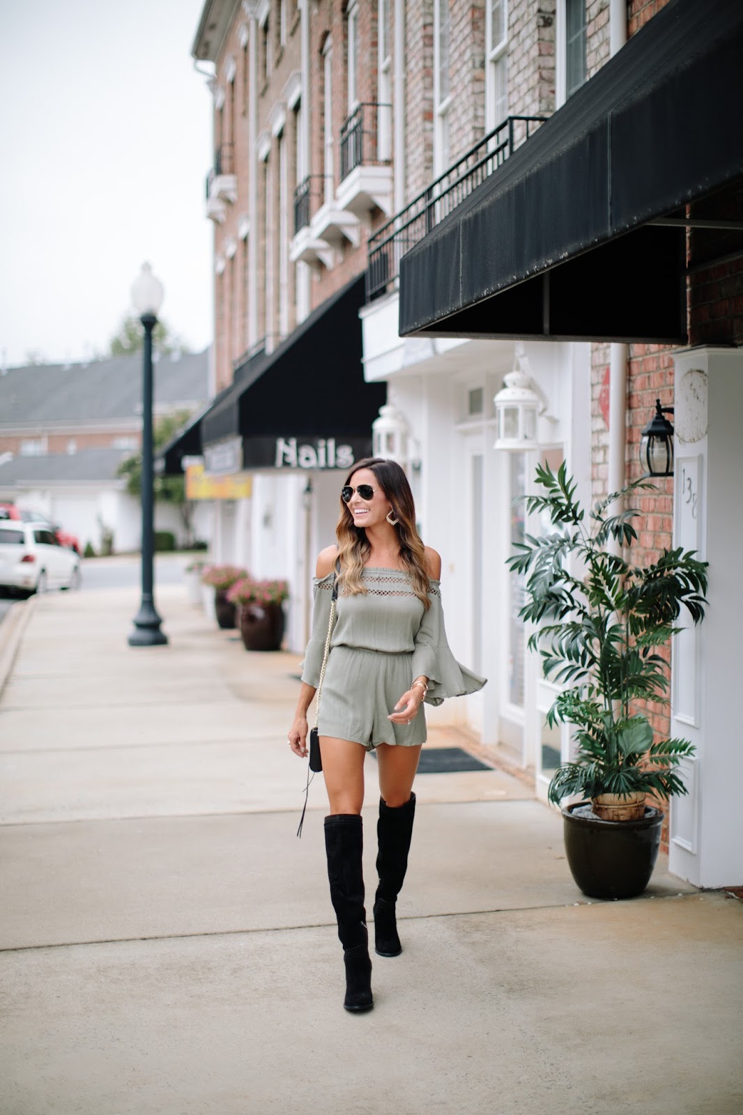 romper with black knee high boots 