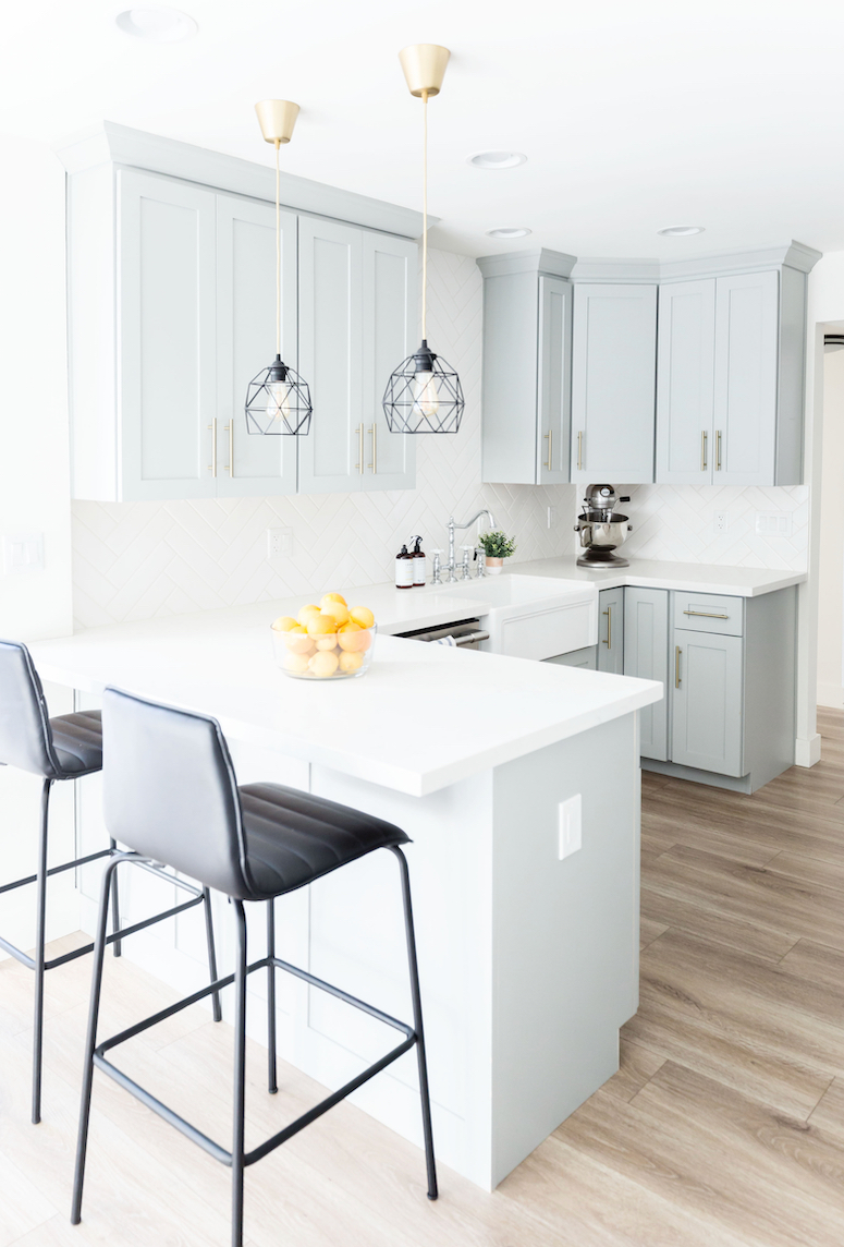 beautiful grey blue kitchen cabinets with gold hardware