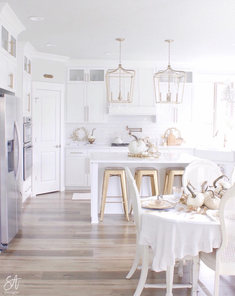 white gold and glam pumpkins in kitchen