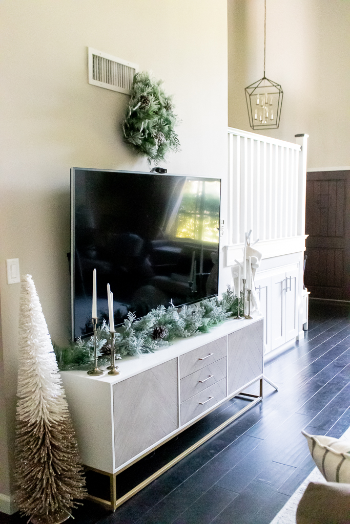 wreath above tv stand living room christmas decor 