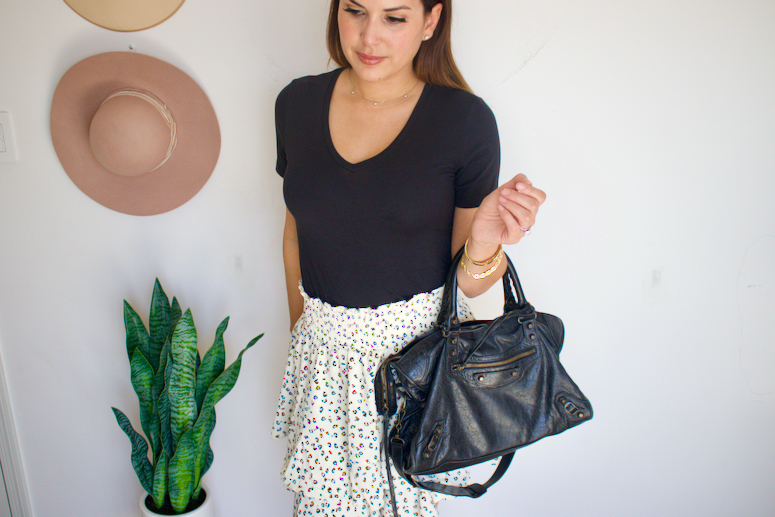 black t-shirt with skirt outfit and Balenciaga city bag 