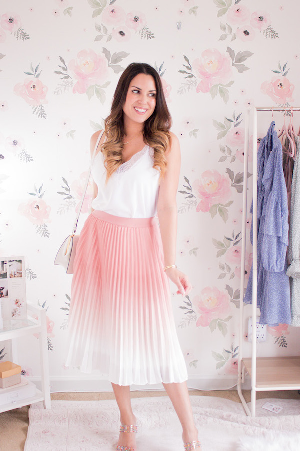 Street style  Printed mini skirt, black crop top and pastel pink