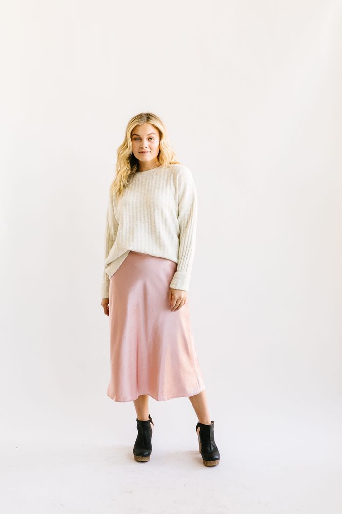 outfits with pink skirts: satin skirt with sweater and ankle boots