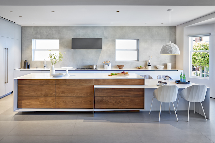 modern white kitchen with concrete backsplash 