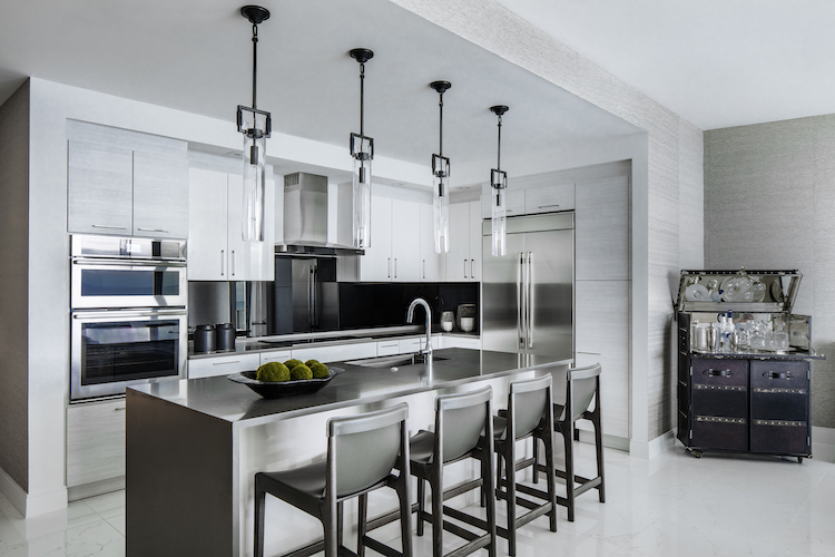 white kitchen cabinets with black backsplash