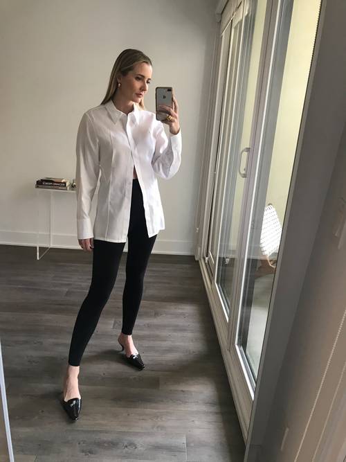 white poplin shirt paired with black leggings 