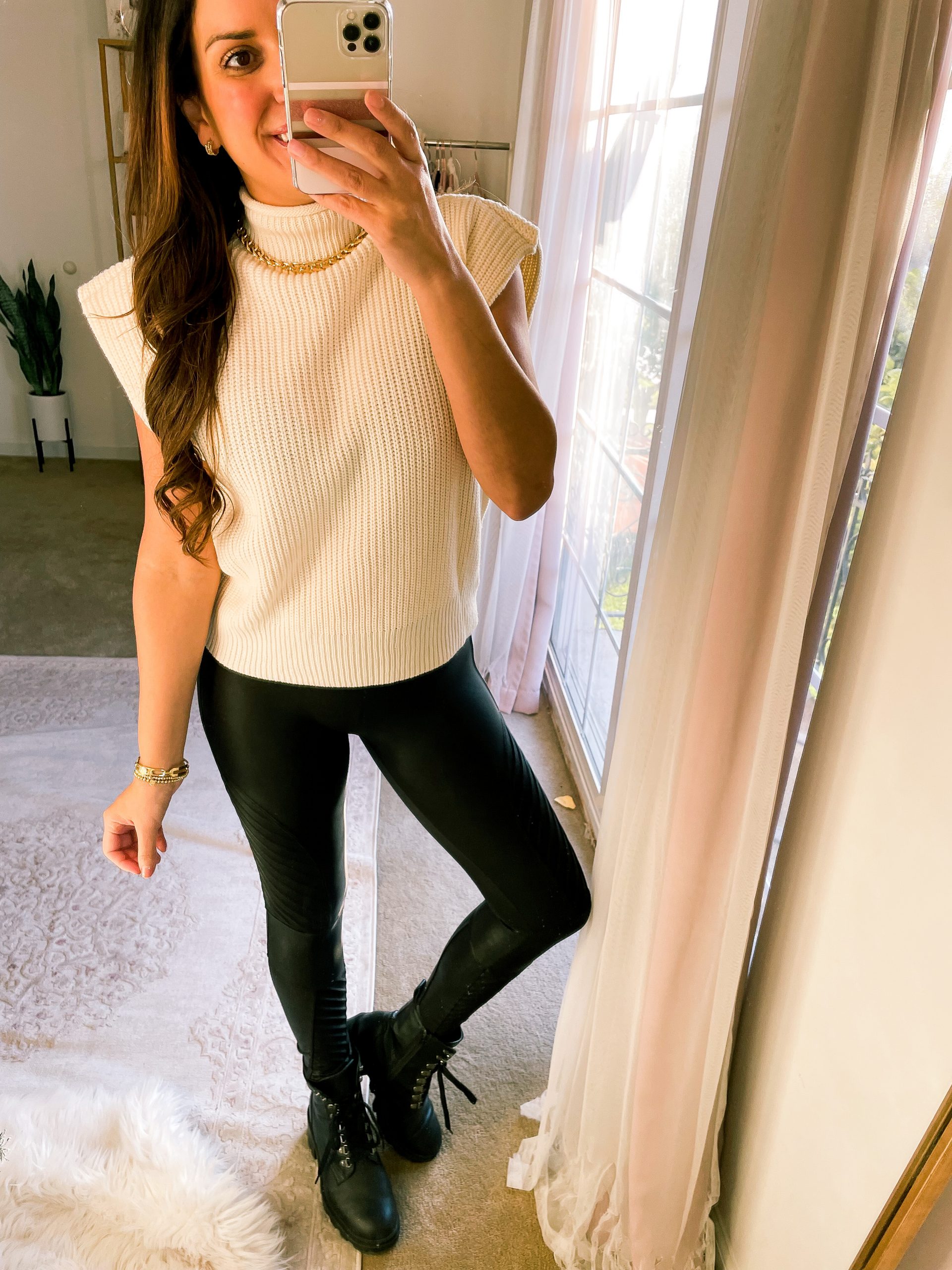 mockneck sleeveless knit sweater with faux leather leggings 