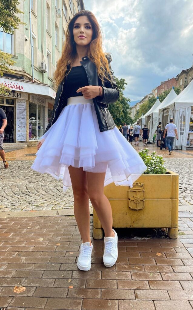 white tulle skirt sneakers leather jacket 