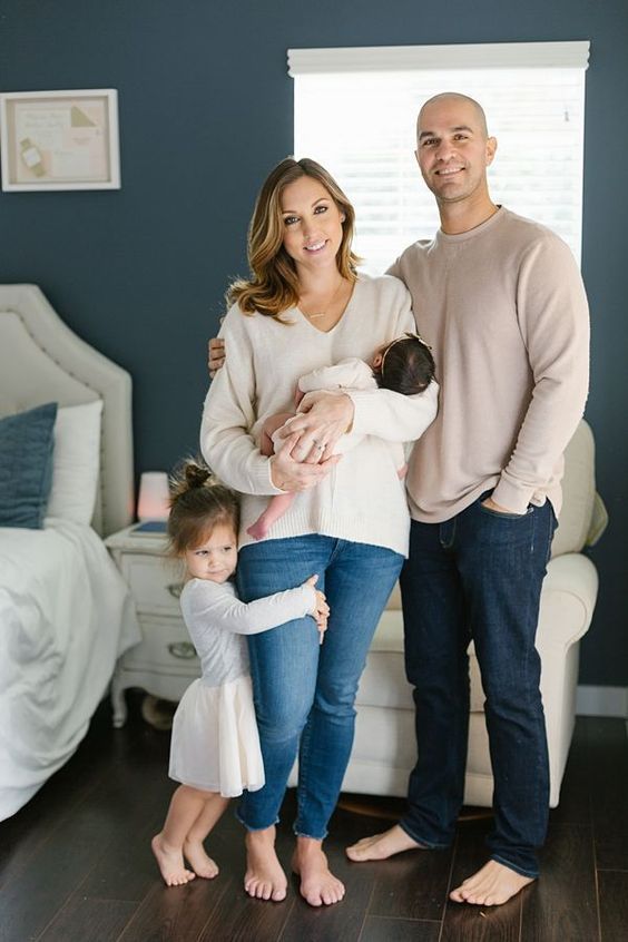 denim jeans with a flowy top for a newborn photoshoot ideas for moms