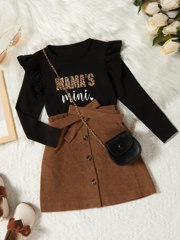 little girl's black top with brown belted skirt 