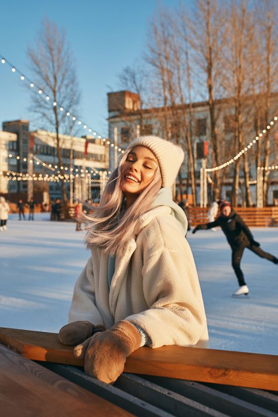 woman ice skating with sherpa gloves, outfits to wear ice skating