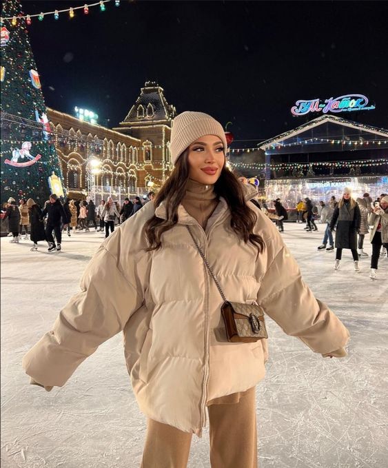 woman wearing an oversized puffer, outfits to wear ice skating