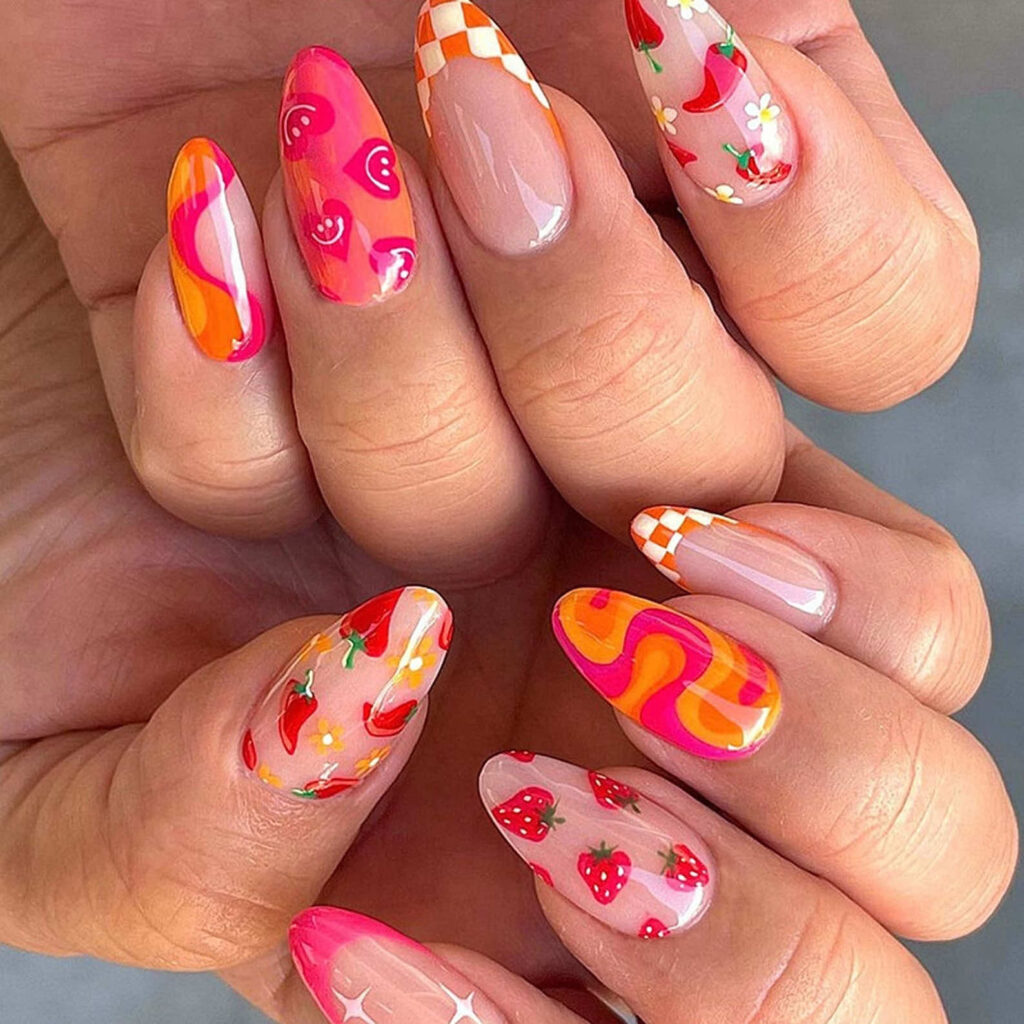 Bright pink and orange pattered fun summer press on nail design inspiration