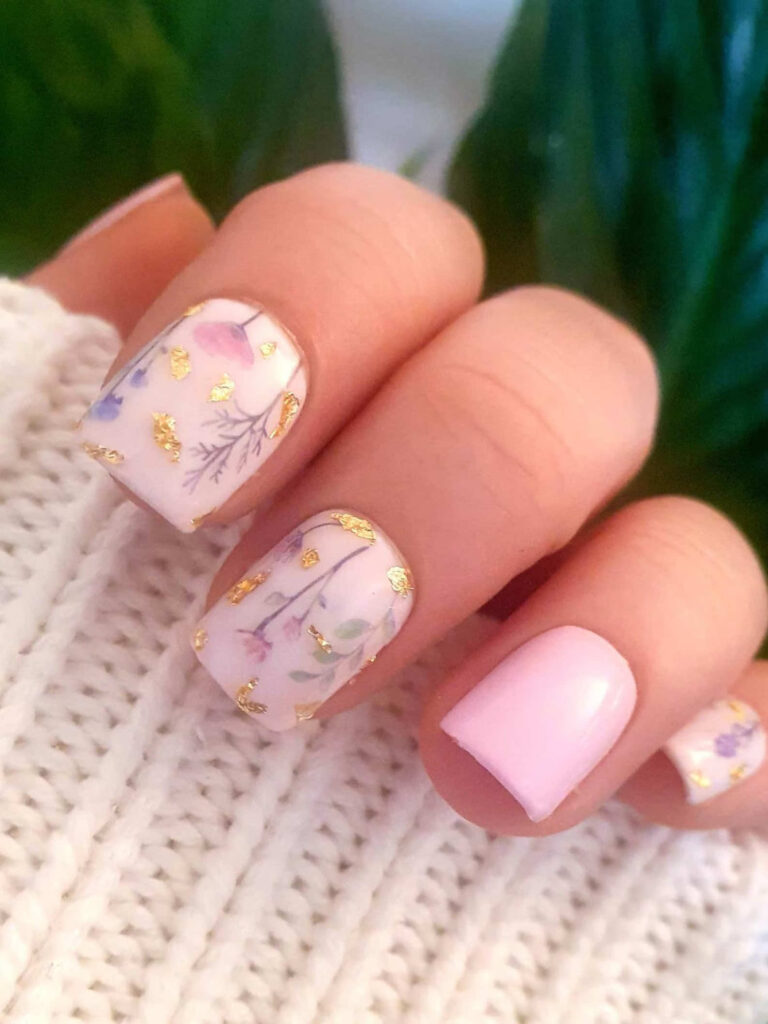 Press on acrylic nails with pastel pressed flowers and gold leaf for summer