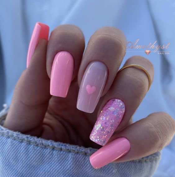 pink barbie nails with sparkles and heart