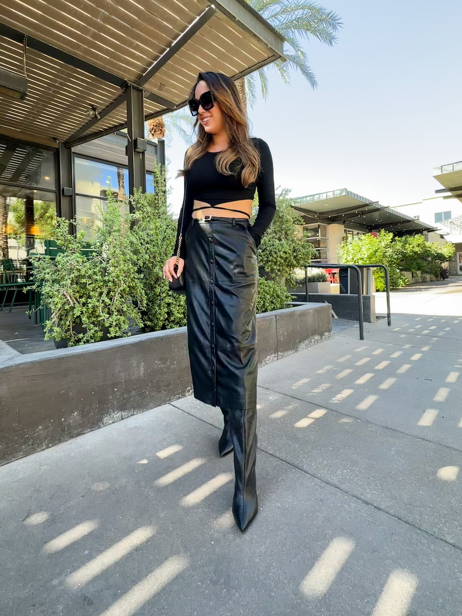 black faux leather skirt with boots outfit