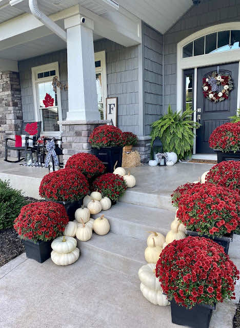 fall front porch decor idea with red and white