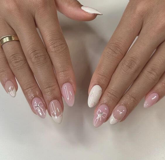 subtle pink bow nails for holiday trend