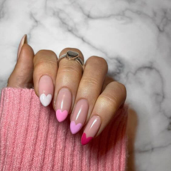 pink french tip valentine's day nail ideas with hearts