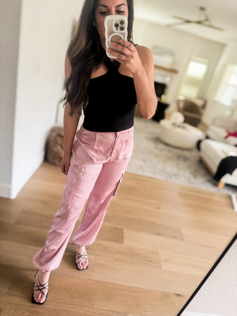 silky pink cargo pants with black tank top 