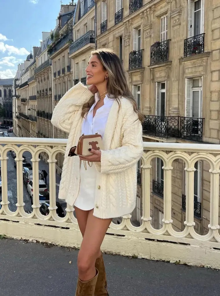 cream colored cardigan with tailored shorts and white button down 