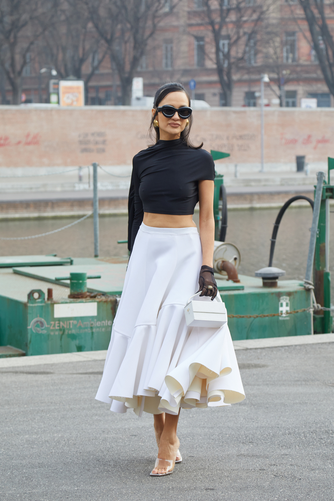 white midi skirt outfit with blackcrop top and clear heels