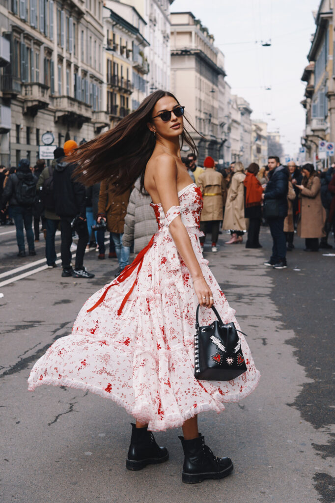 stylish woman wearing combat boots with a dress