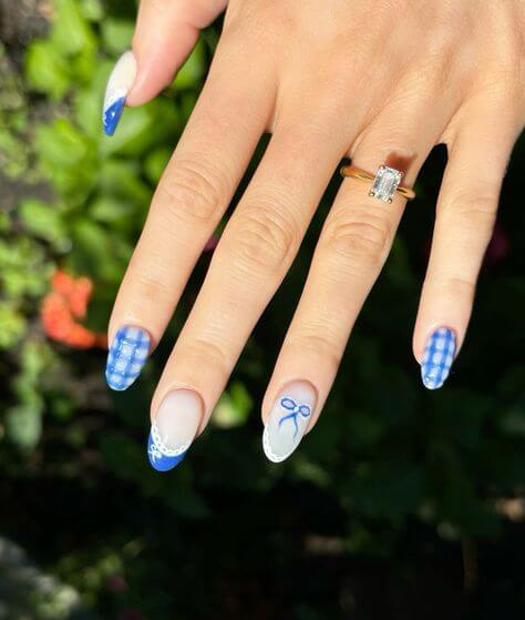 cute bow nail inspo in blue