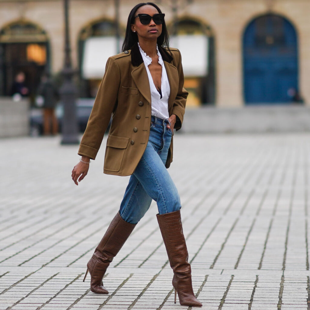 straight leg jeans with knee high boots and brown blazer jacket