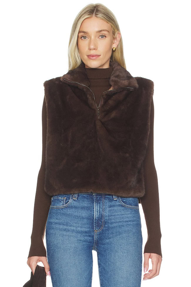 Dark brown faux fur vest worn over a brown turtleneck with jeans, French Riviera layering piece